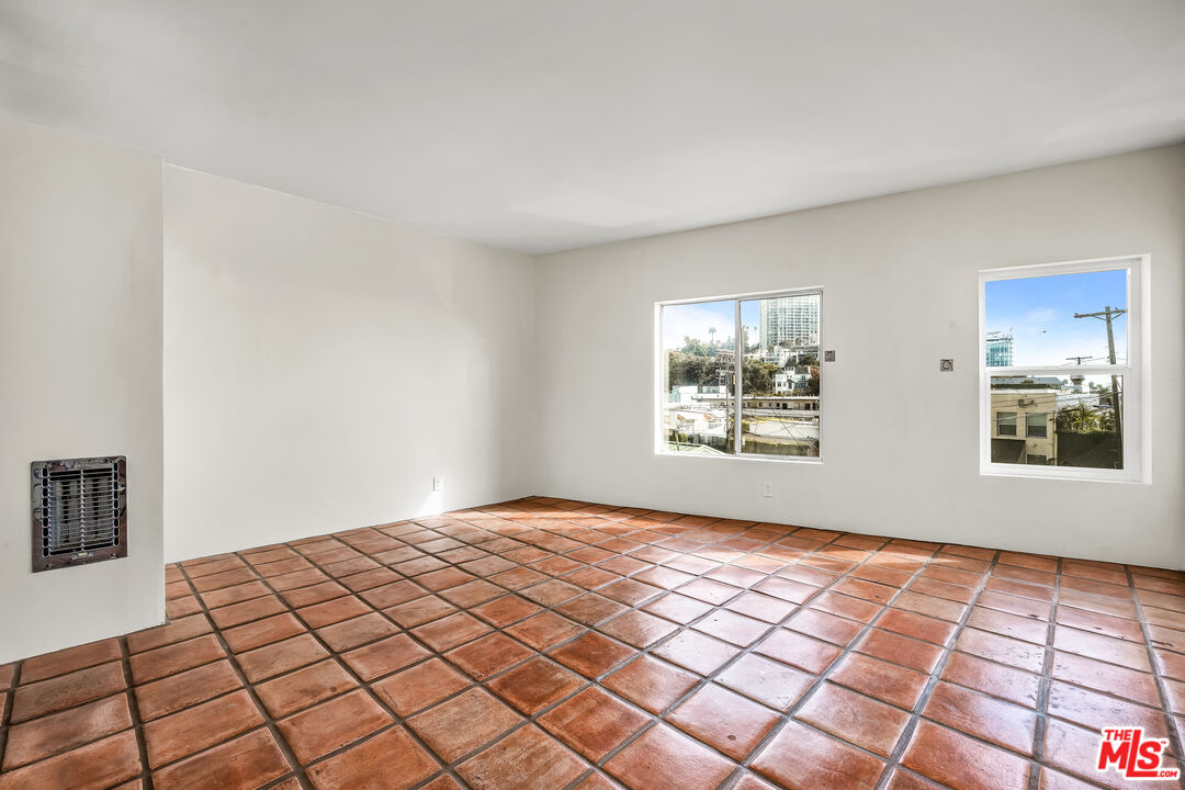 a view of an empty room and window