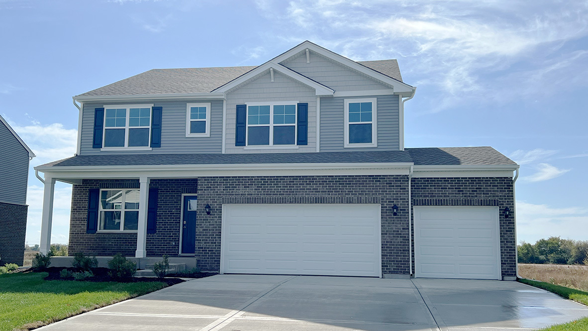 front view of a house with a yard