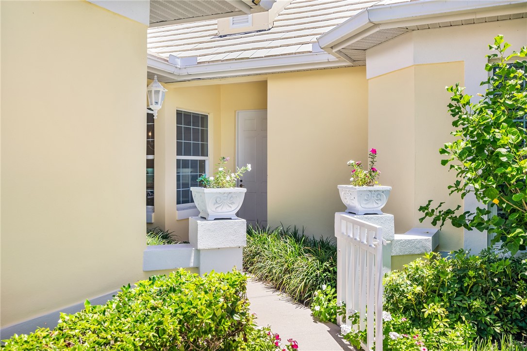 a front view of a house with a fountain