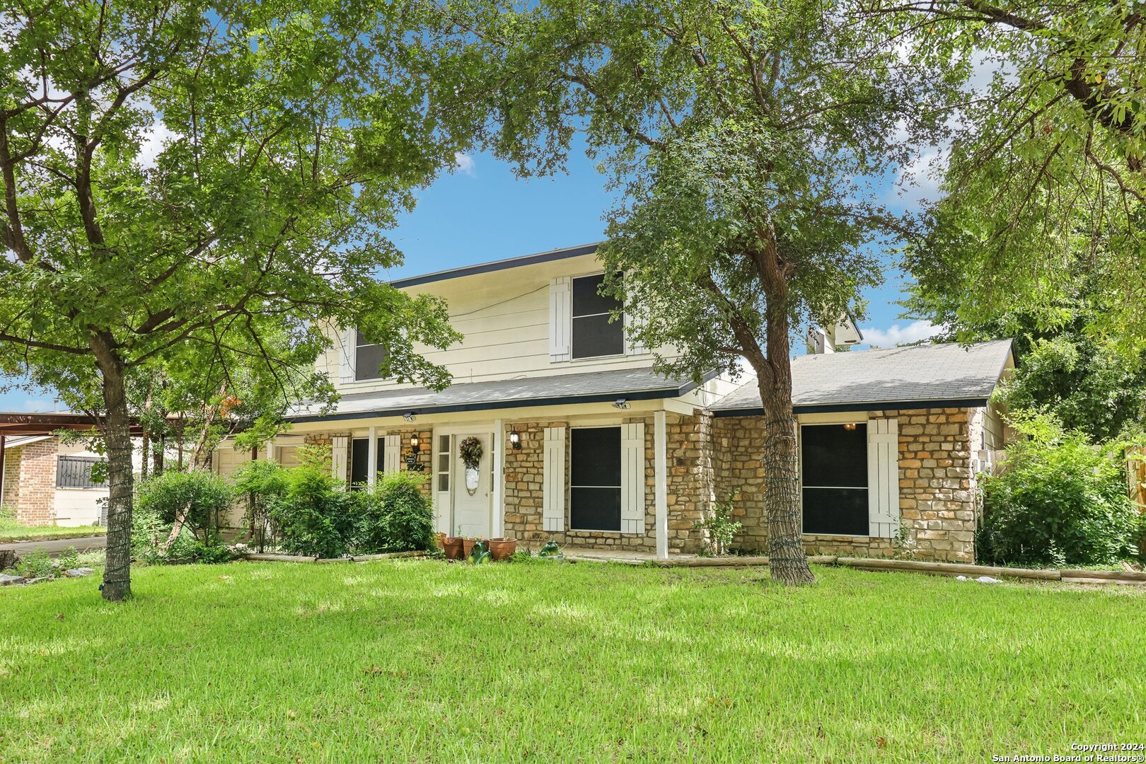 front view of a house and a yard