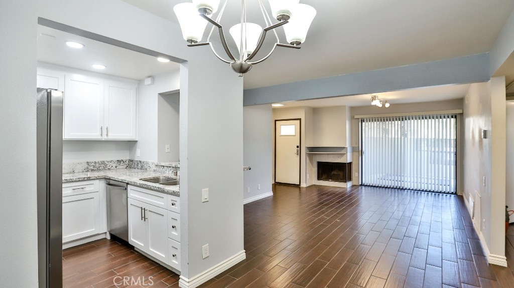 a view of a kitchen cabinets and wooden floor