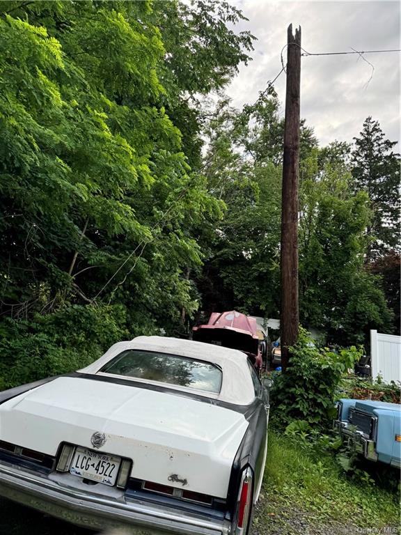 a view of a car parked in the yard