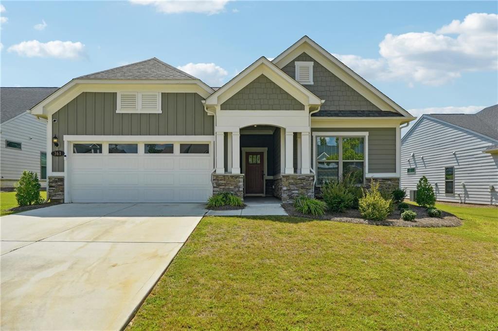 a front view of a house with garden