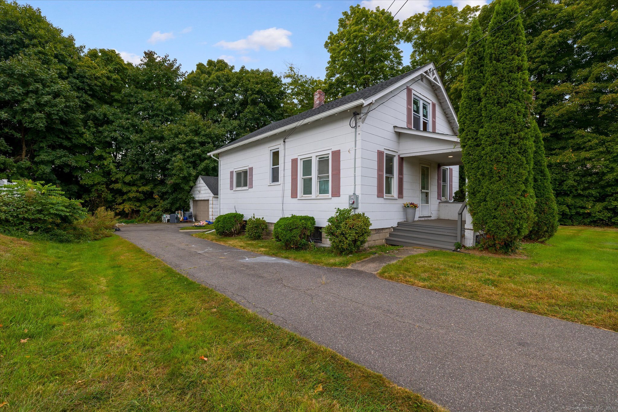 a view of a house with a yard and plants