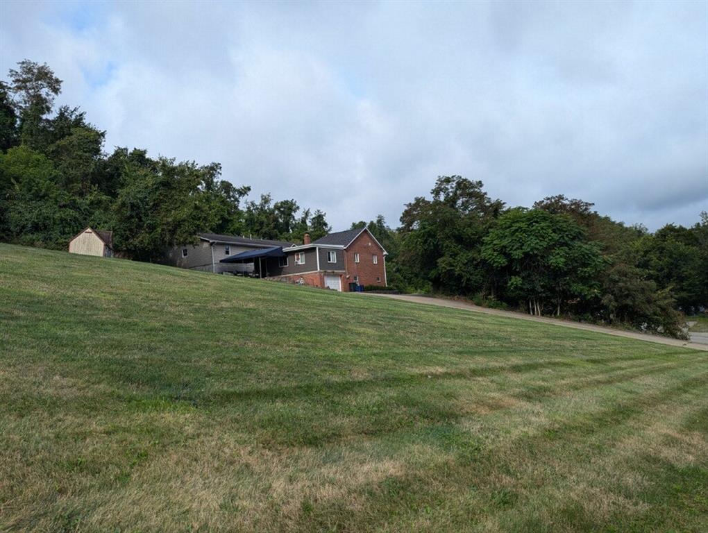 a backyard of a house with lots of green space