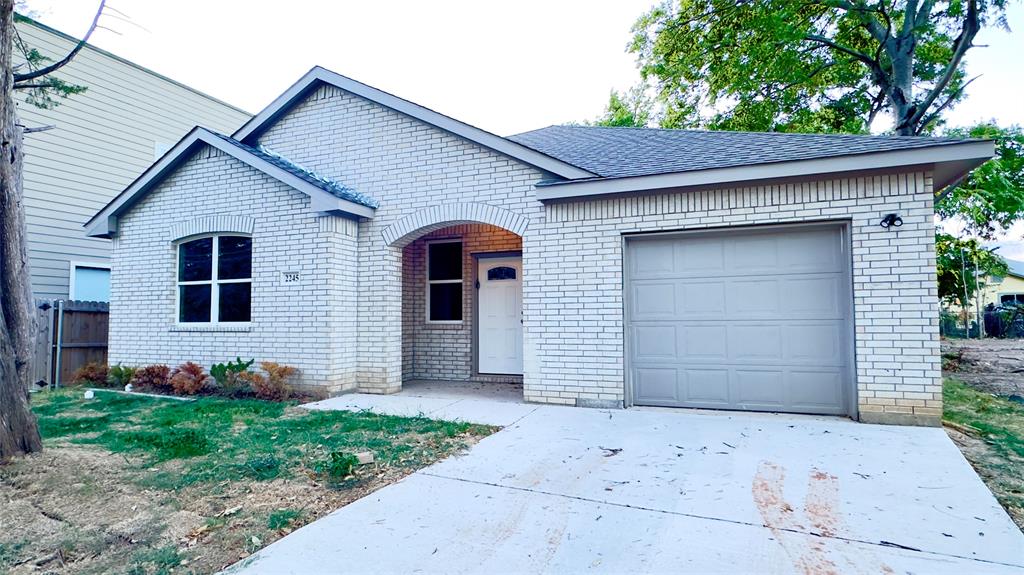 a front view of a house with a garage