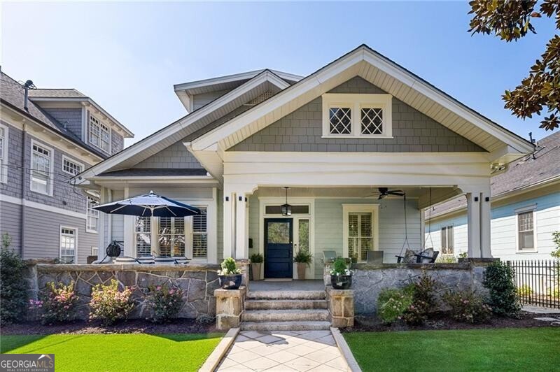 a front view of a house with garden