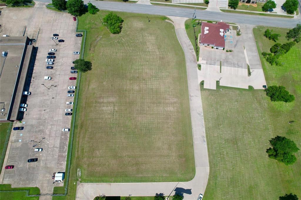 an aerial view of residential house with an outdoor space