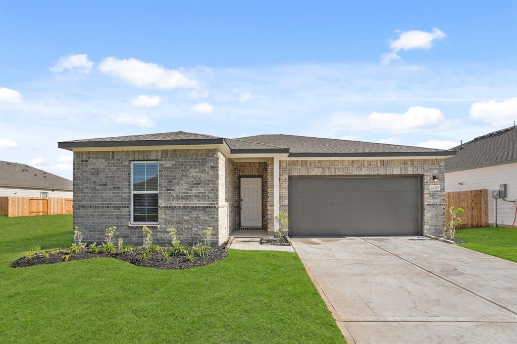 front view of a house with a yard