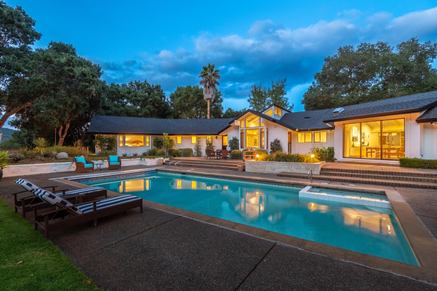 a view of swimming pool with outdoor seating