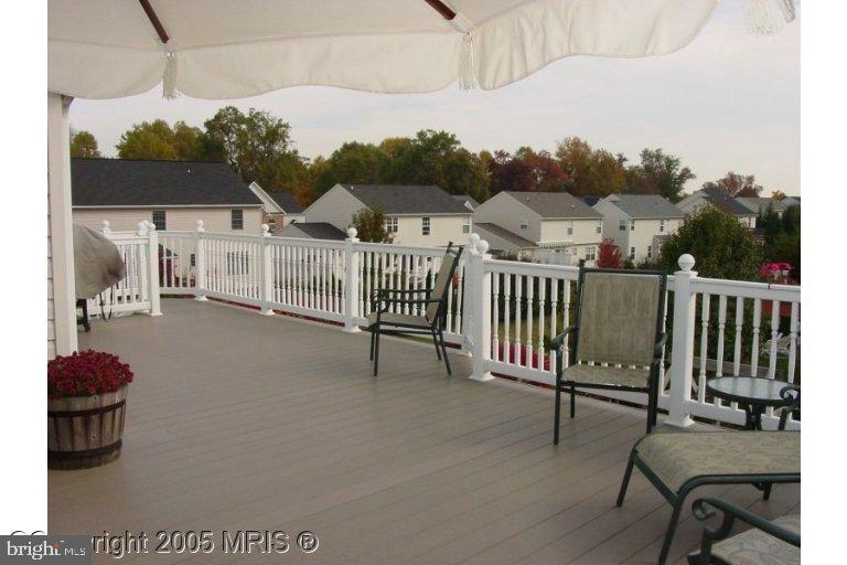 a view of a chairs and table in patio