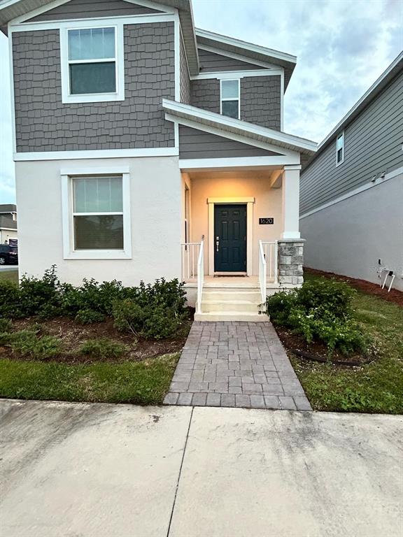 a front view of a house with a yard