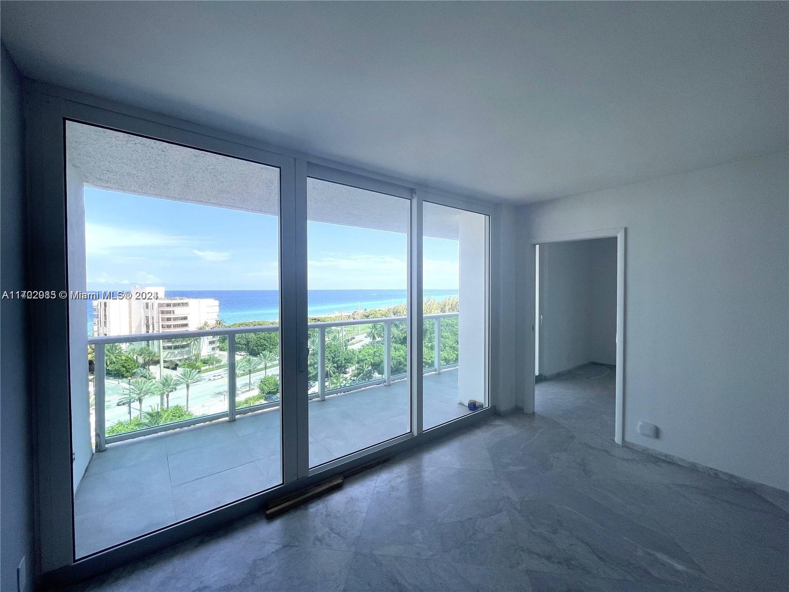 a view of an empty room and window