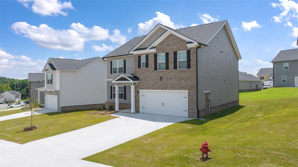 a view of a house with a backyard