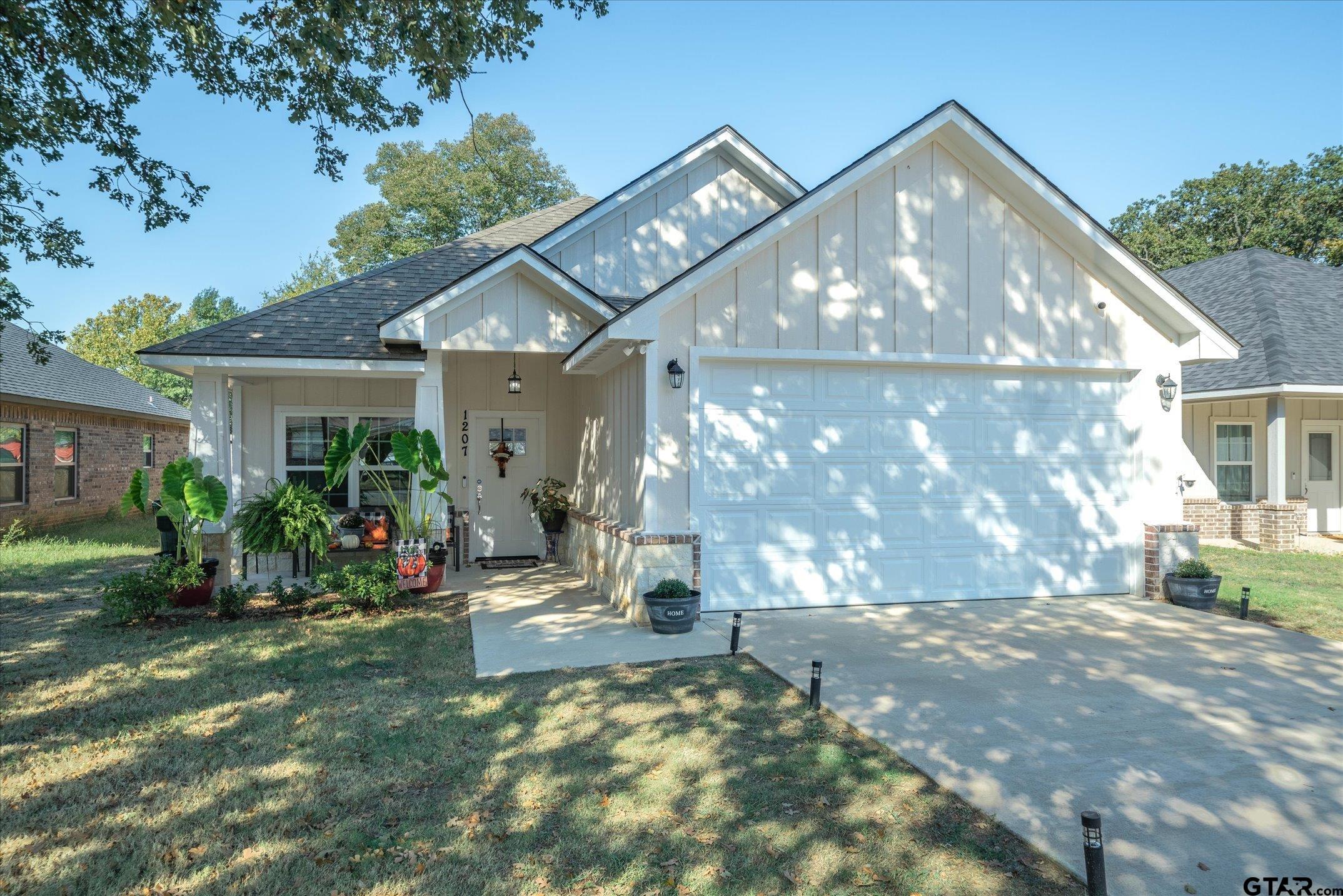 a view of a house with backyard porch and sitting area