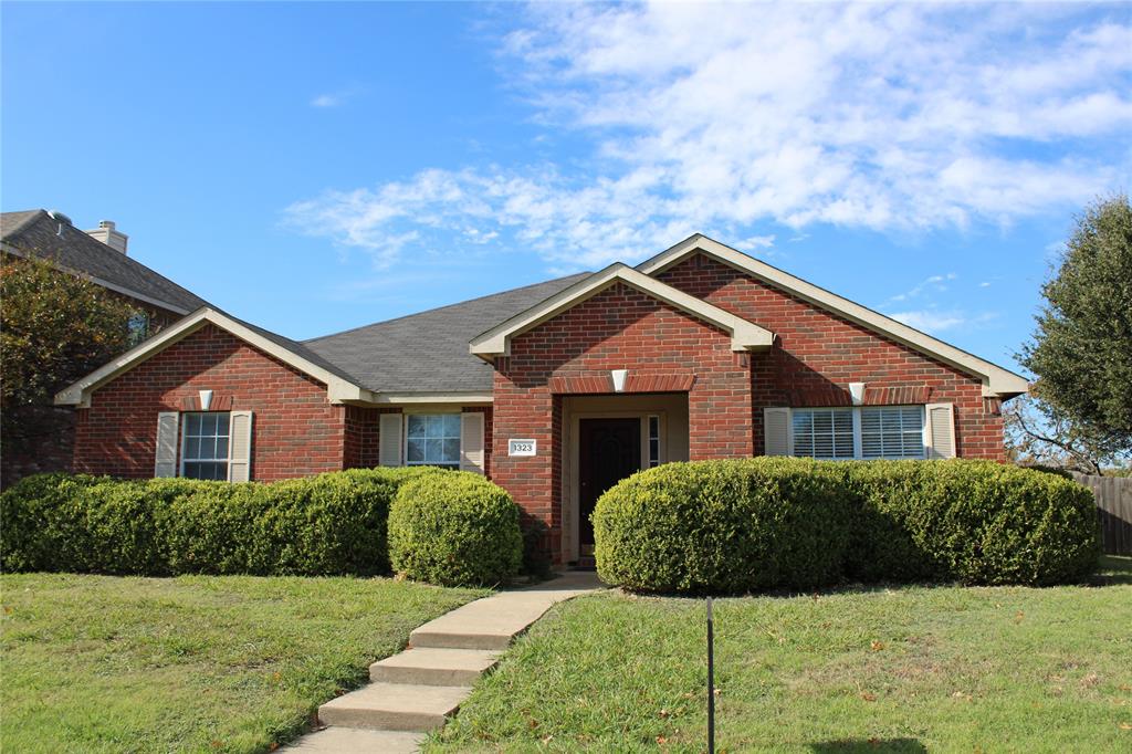 a front view of a house with yard