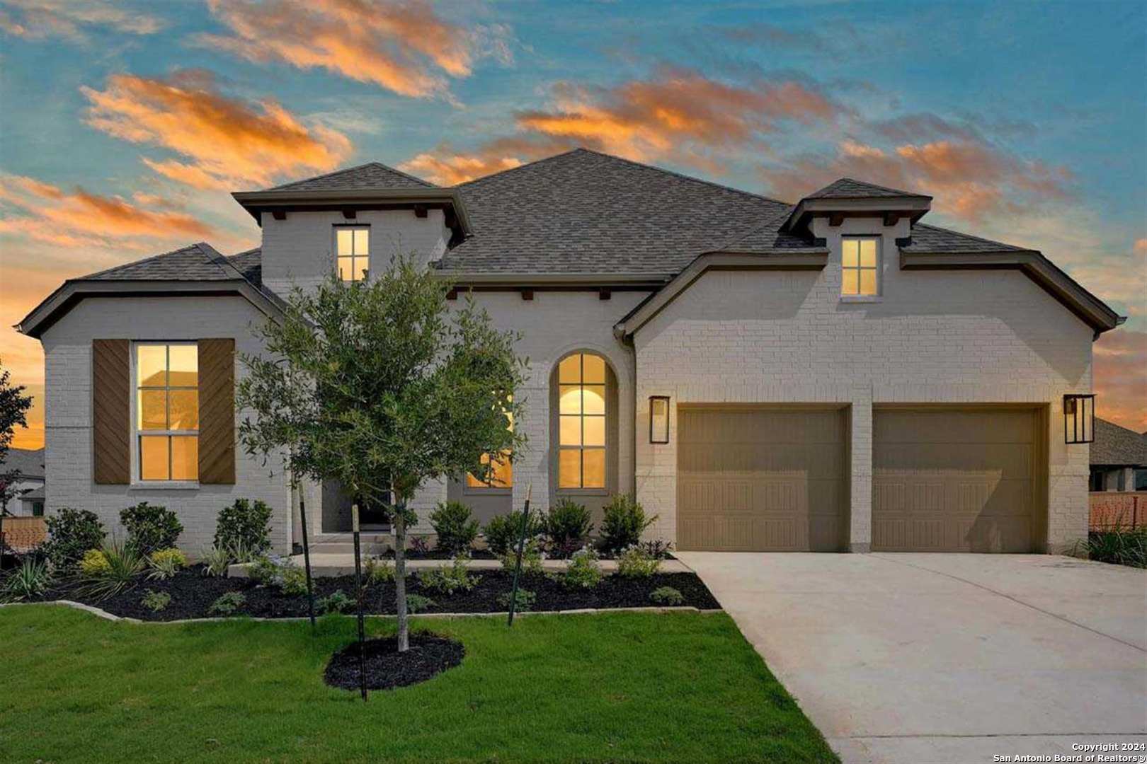 a front view of a house with a yard