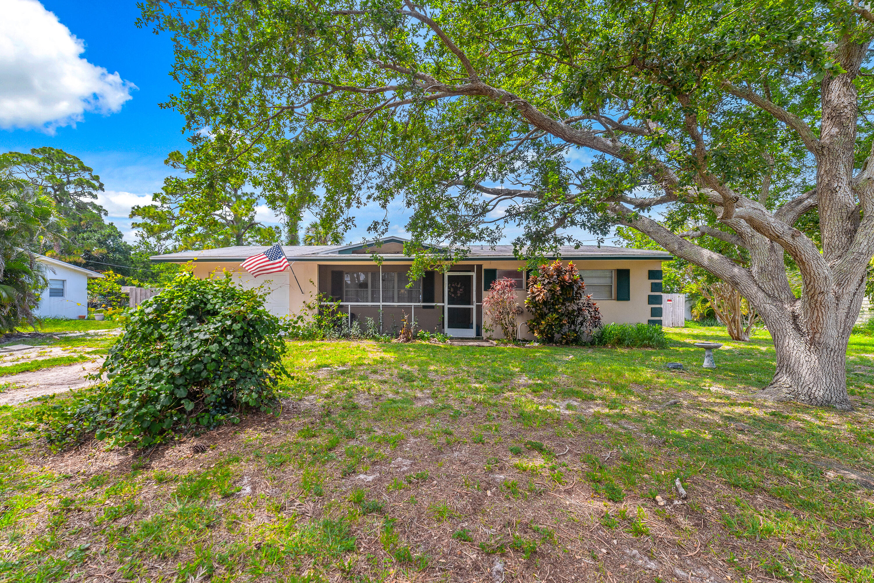 front view of a house with a big yard