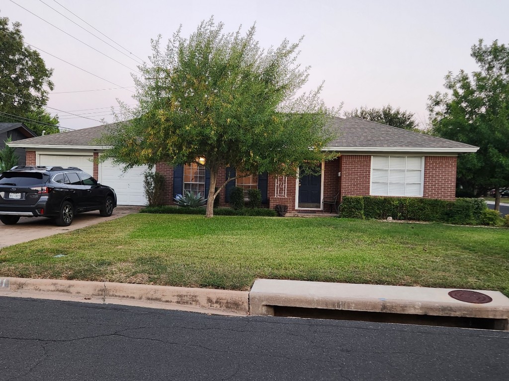 a view of a house with a garden