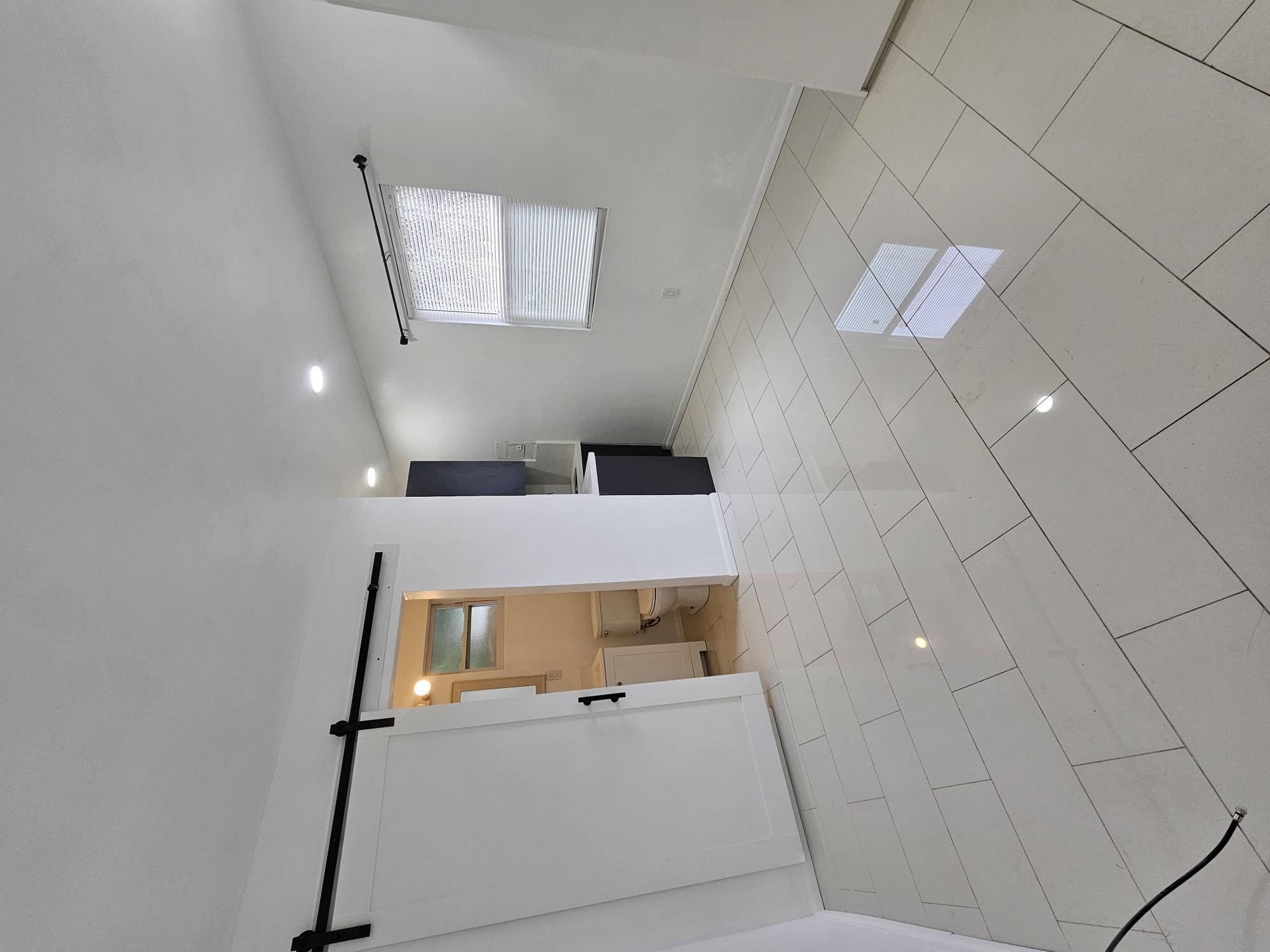 a view of a storage & utility room with a sink