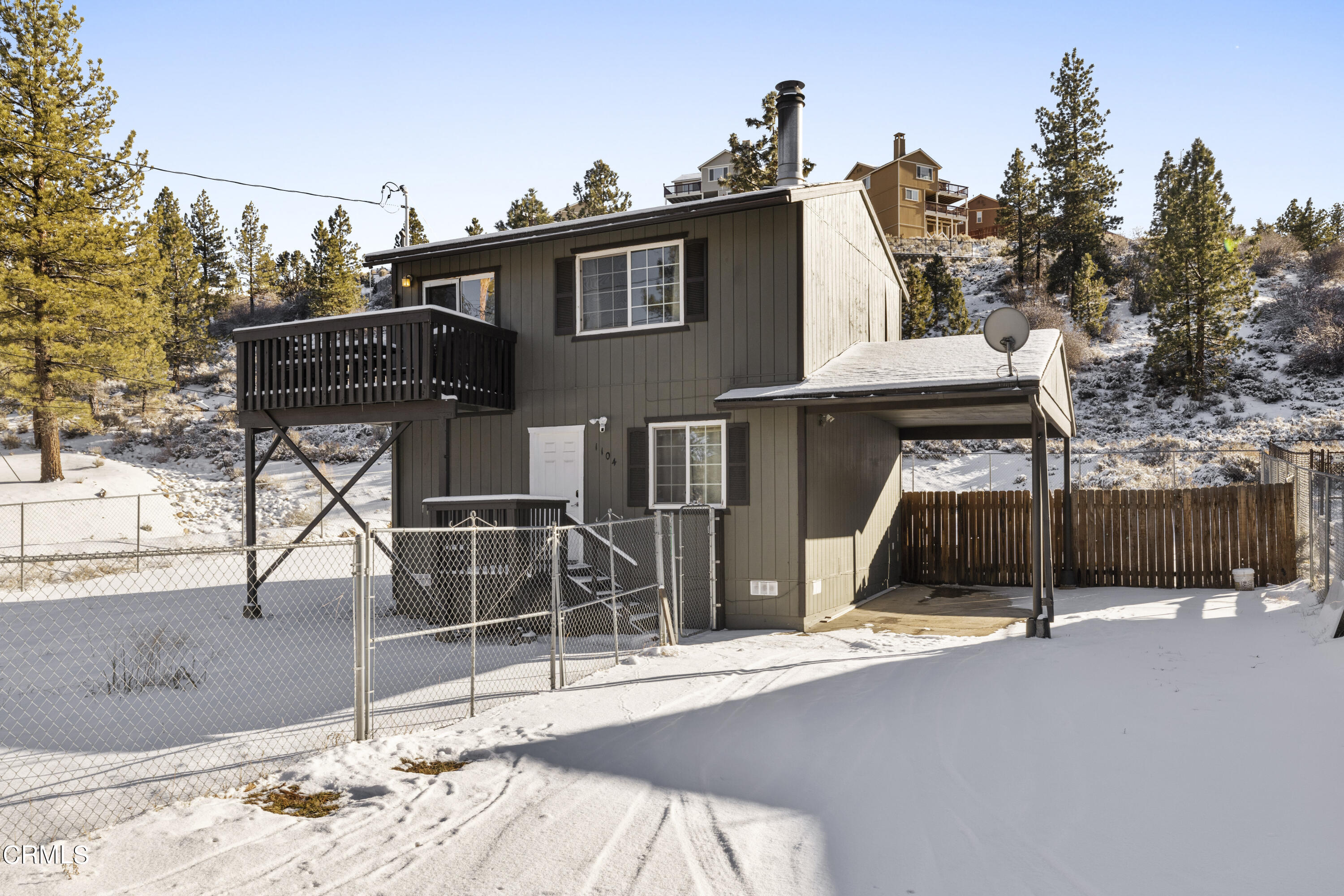 a view of a house with wooden deck