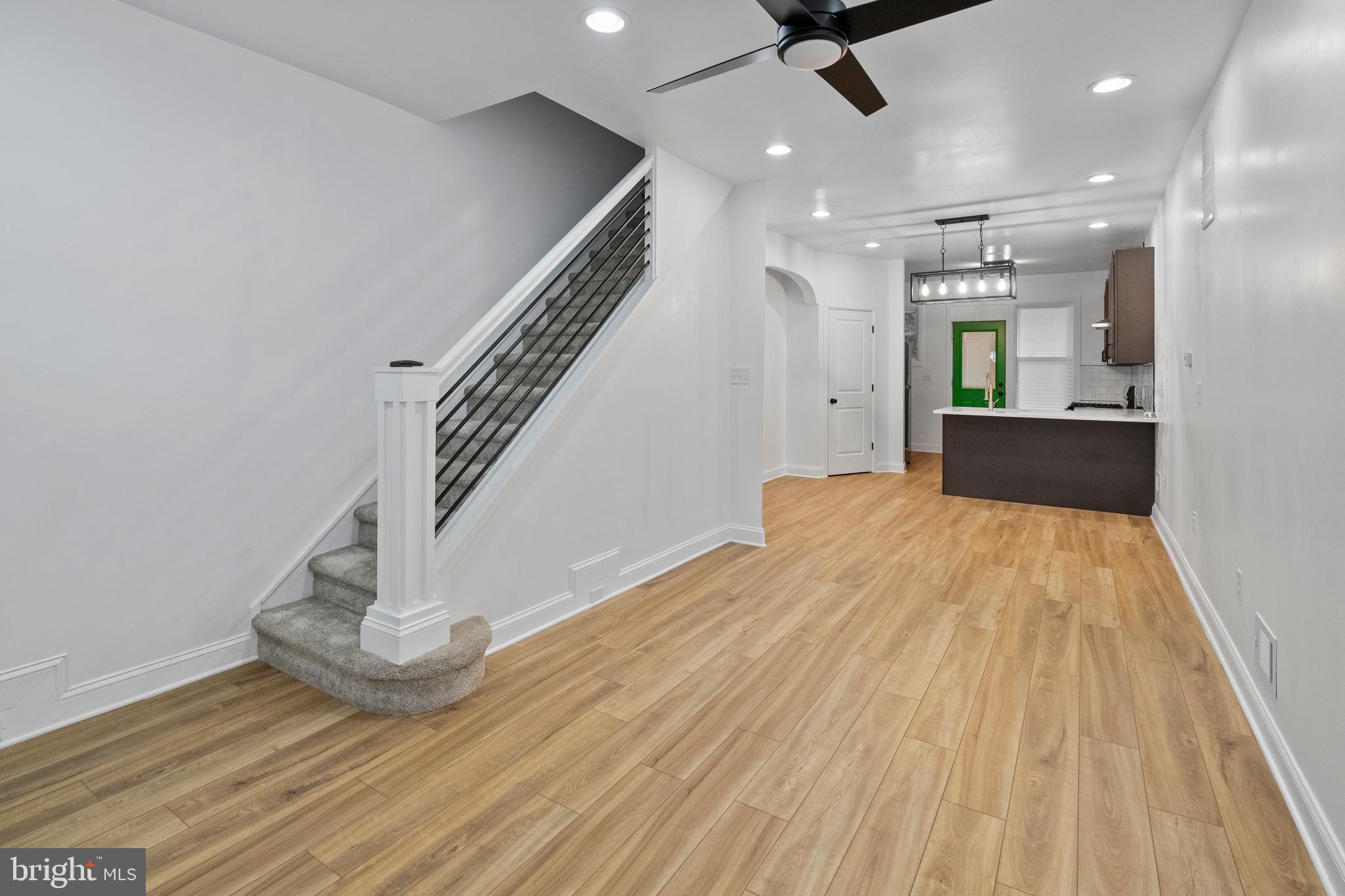 a view of a room with wooden floor