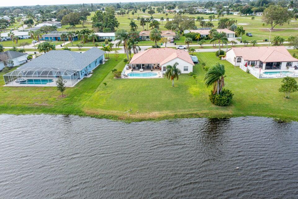 an aerial view of a houses with outdoor space and street view