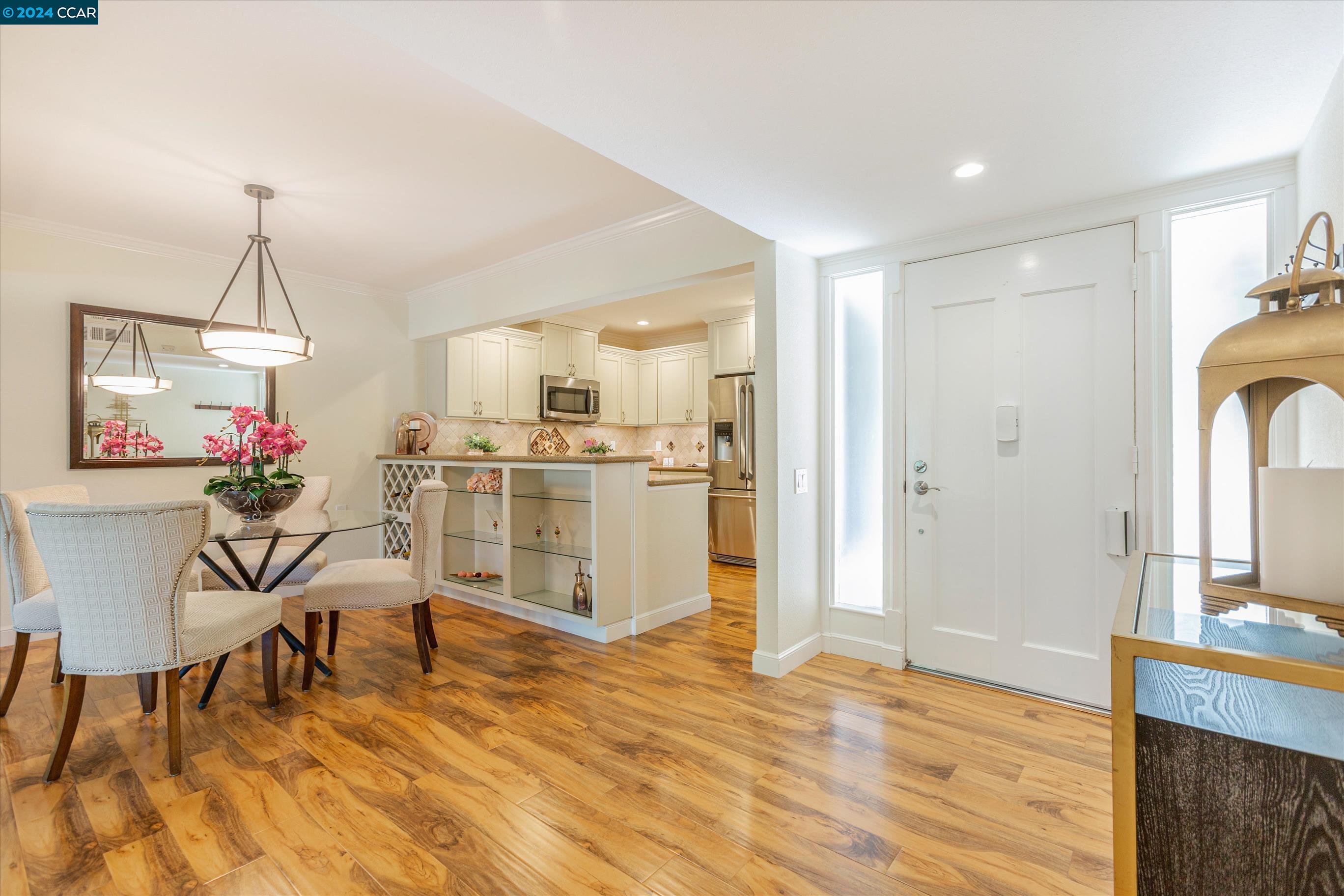 a view of a kitchen and dining room