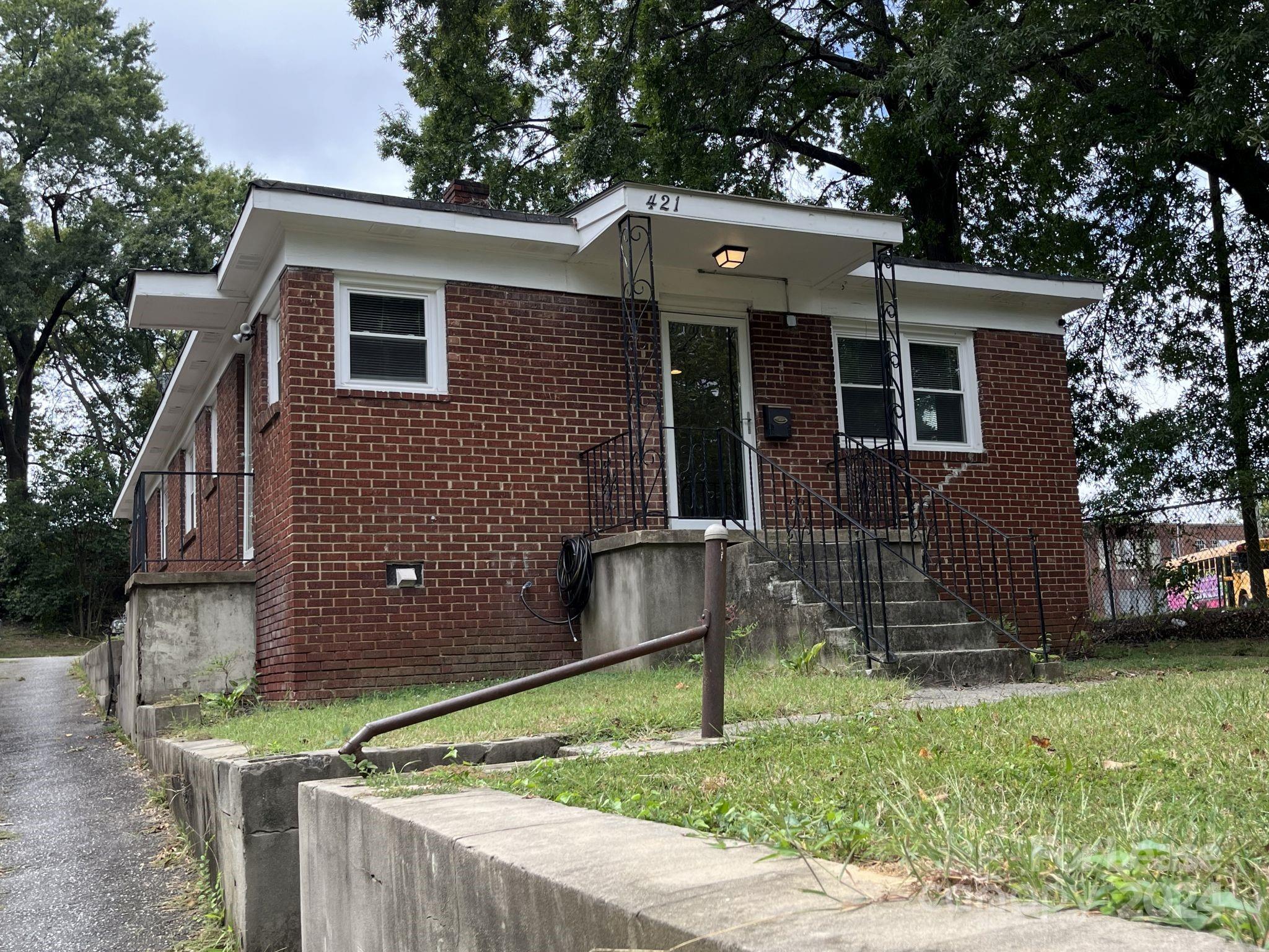 a front view of house with a yard