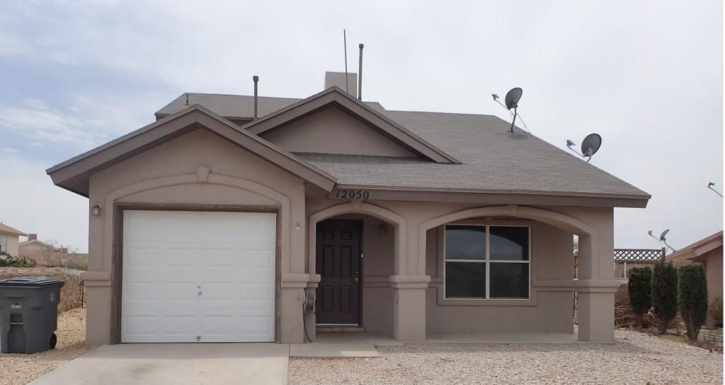 a front view of a house with a garage