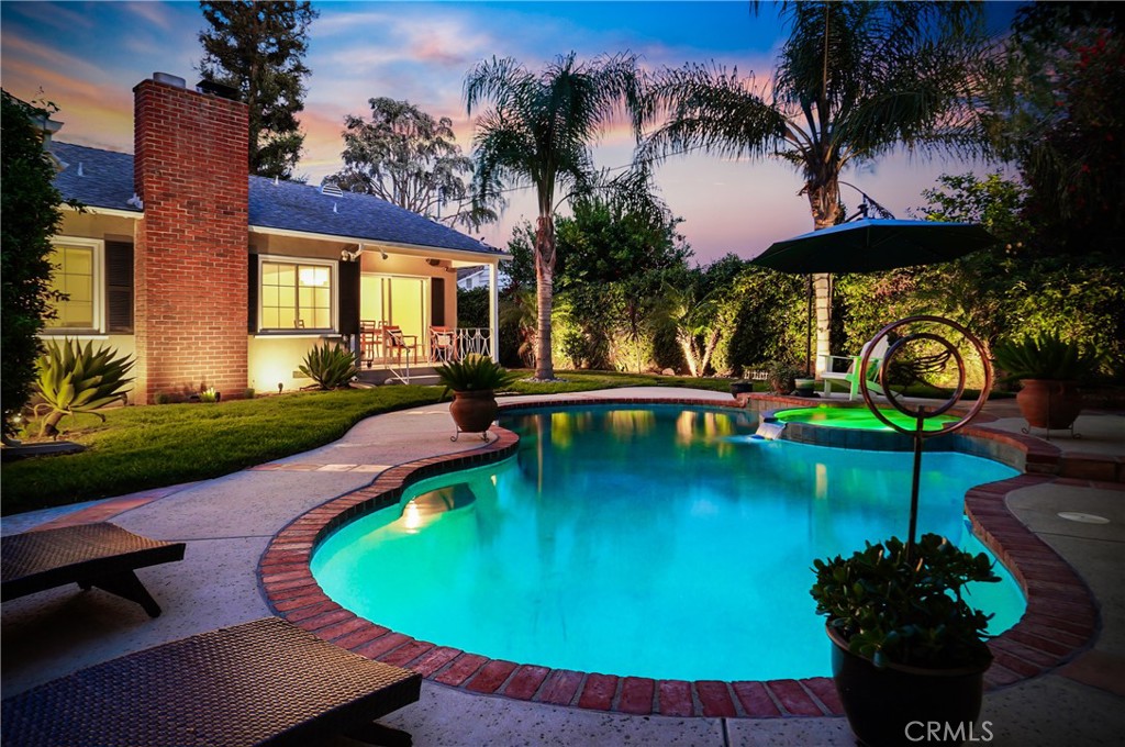 a view of a swimming pool with a patio