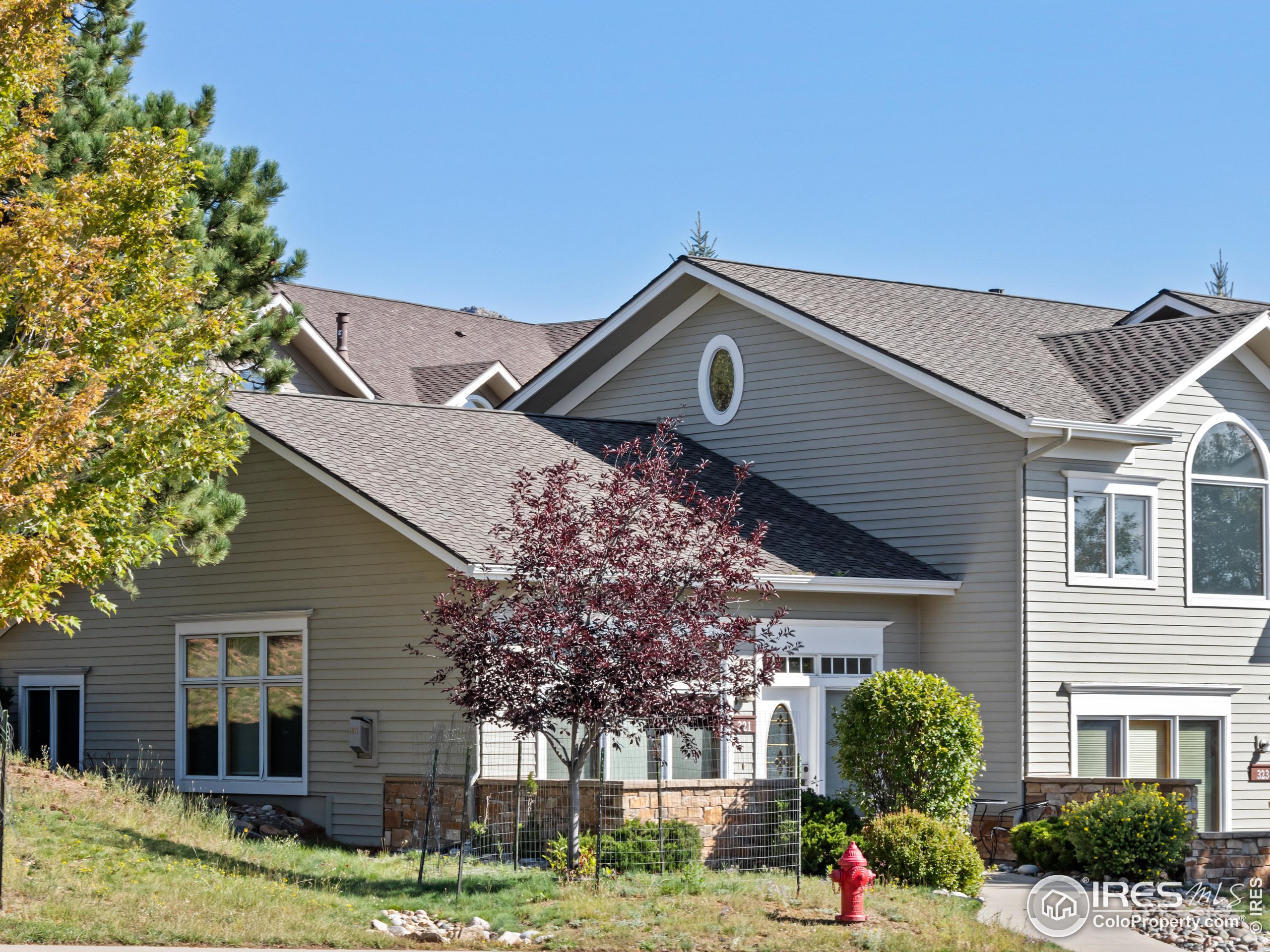 front view of a house with a yard