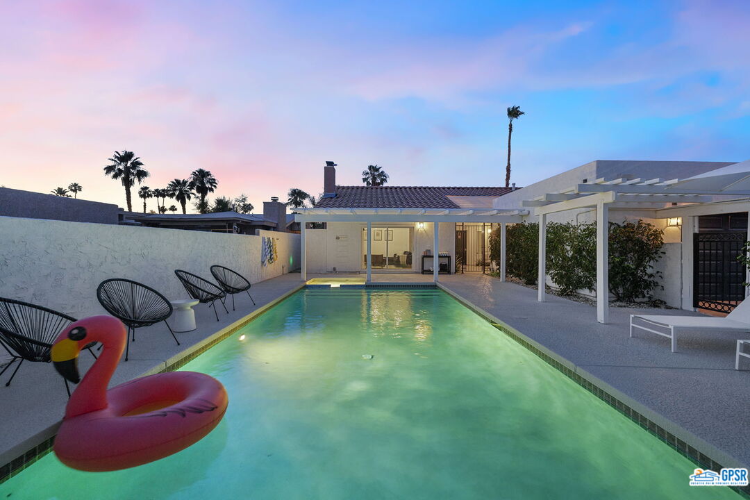 a view of a swimming pool with a patio