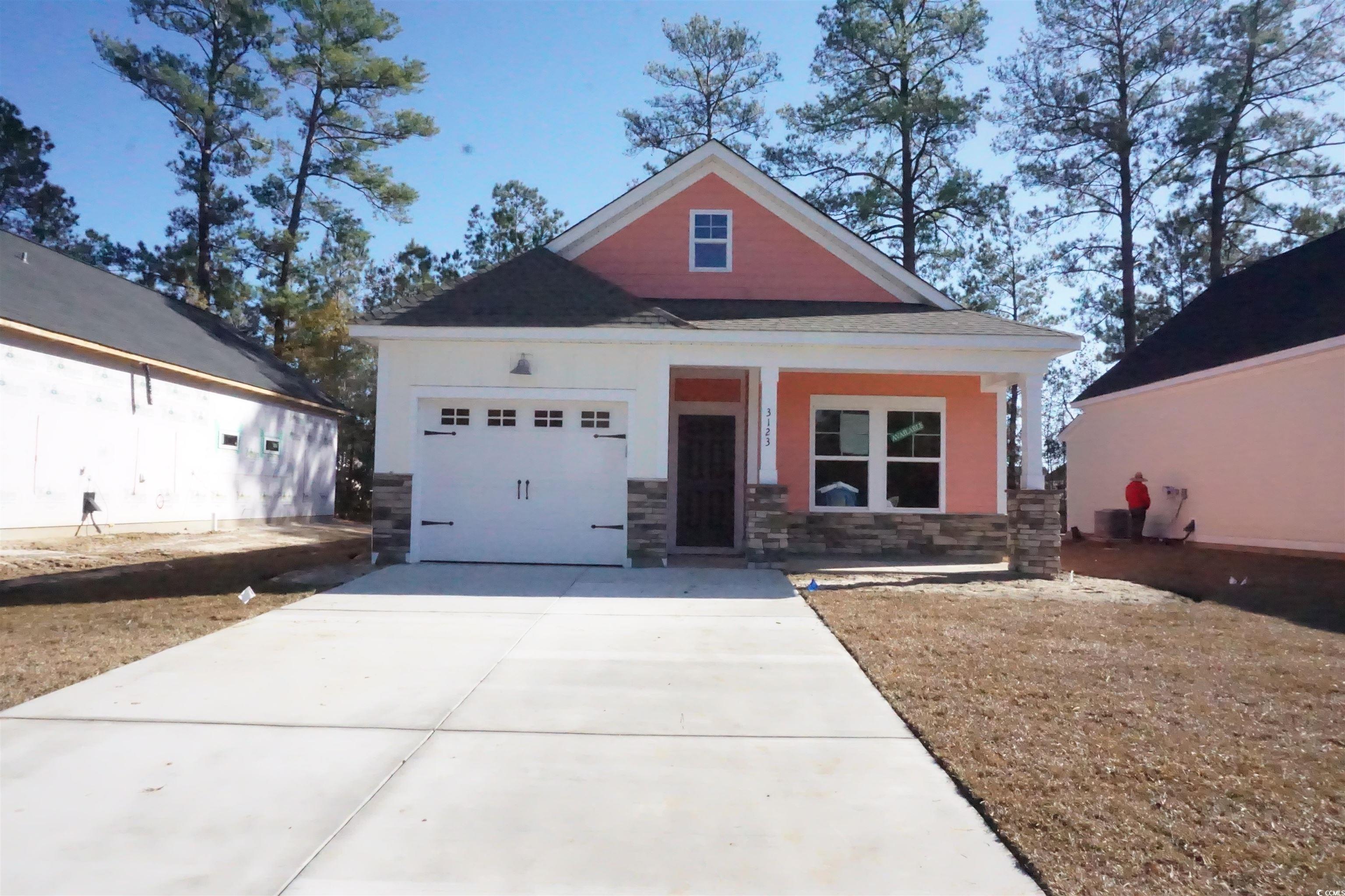 View of front of property featuring a garage