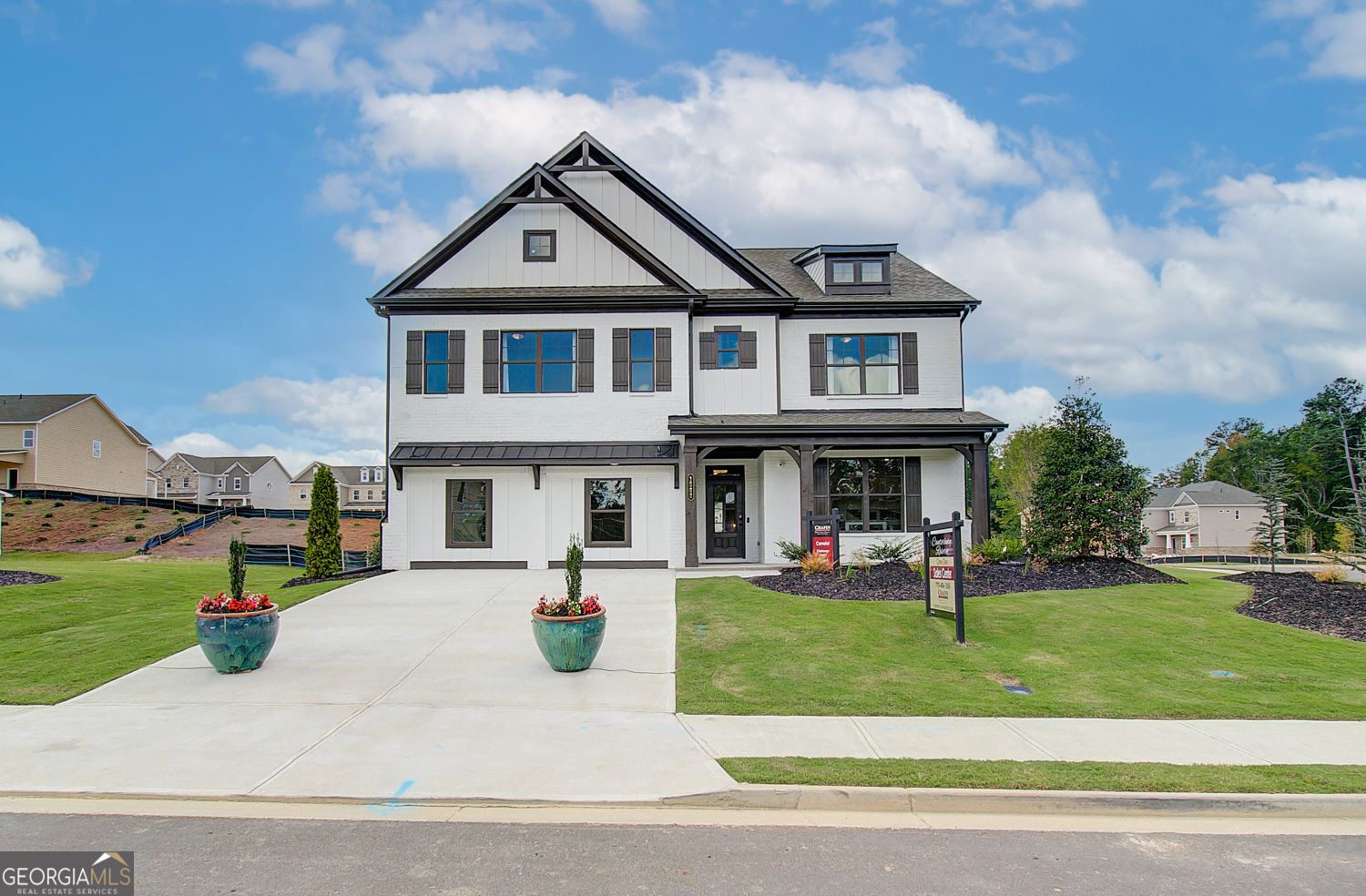 a front view of a house with a yard