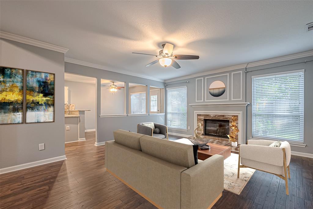 a living room with furniture and a fireplace