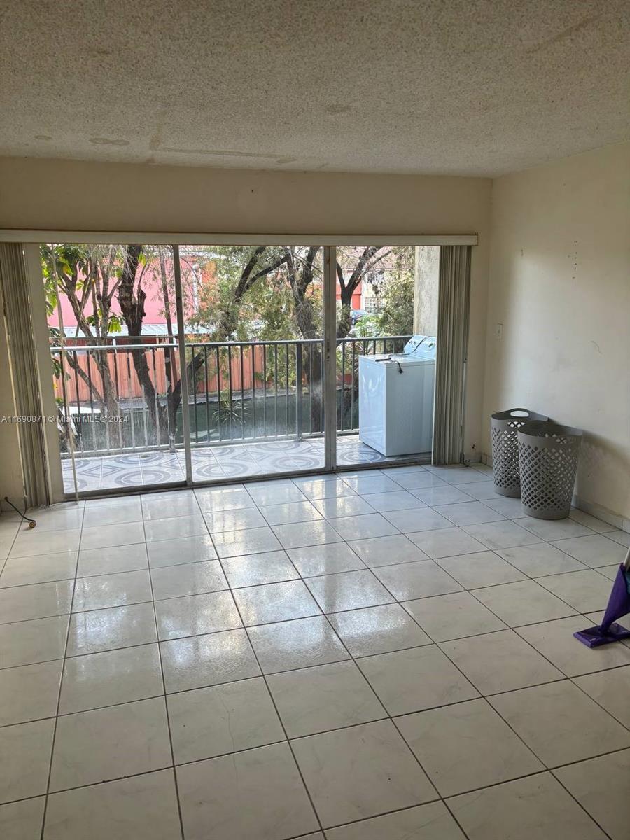 a view of an empty room and window