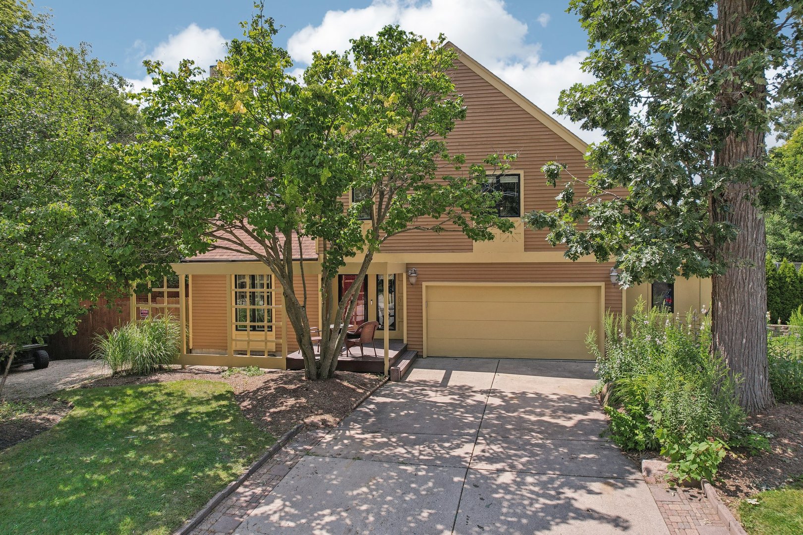 a front view of a house with garden