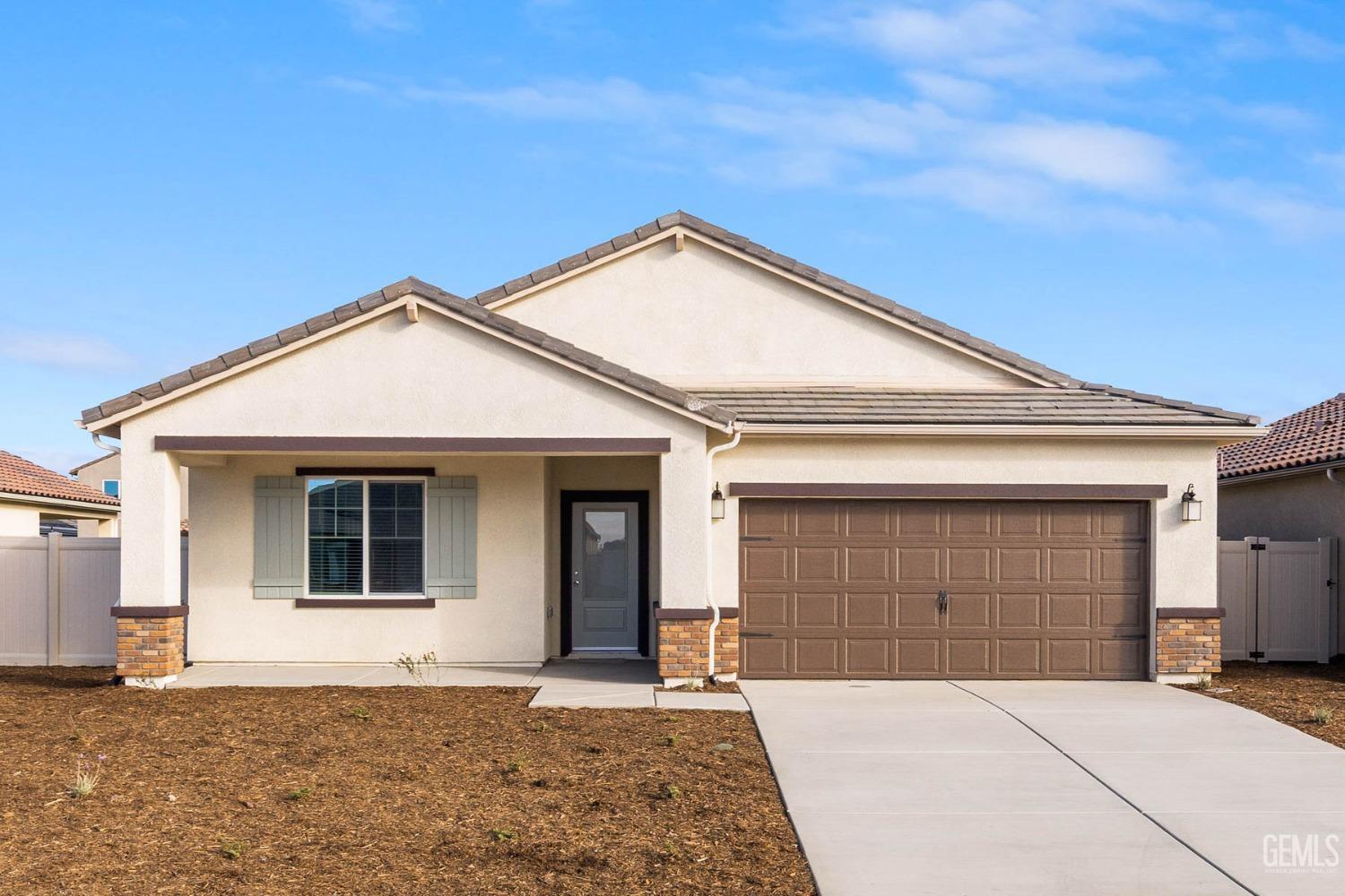 a front view of a house with a garage