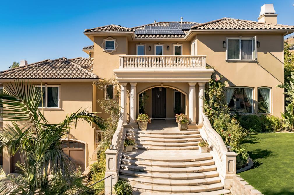 a front view of a house with a porch