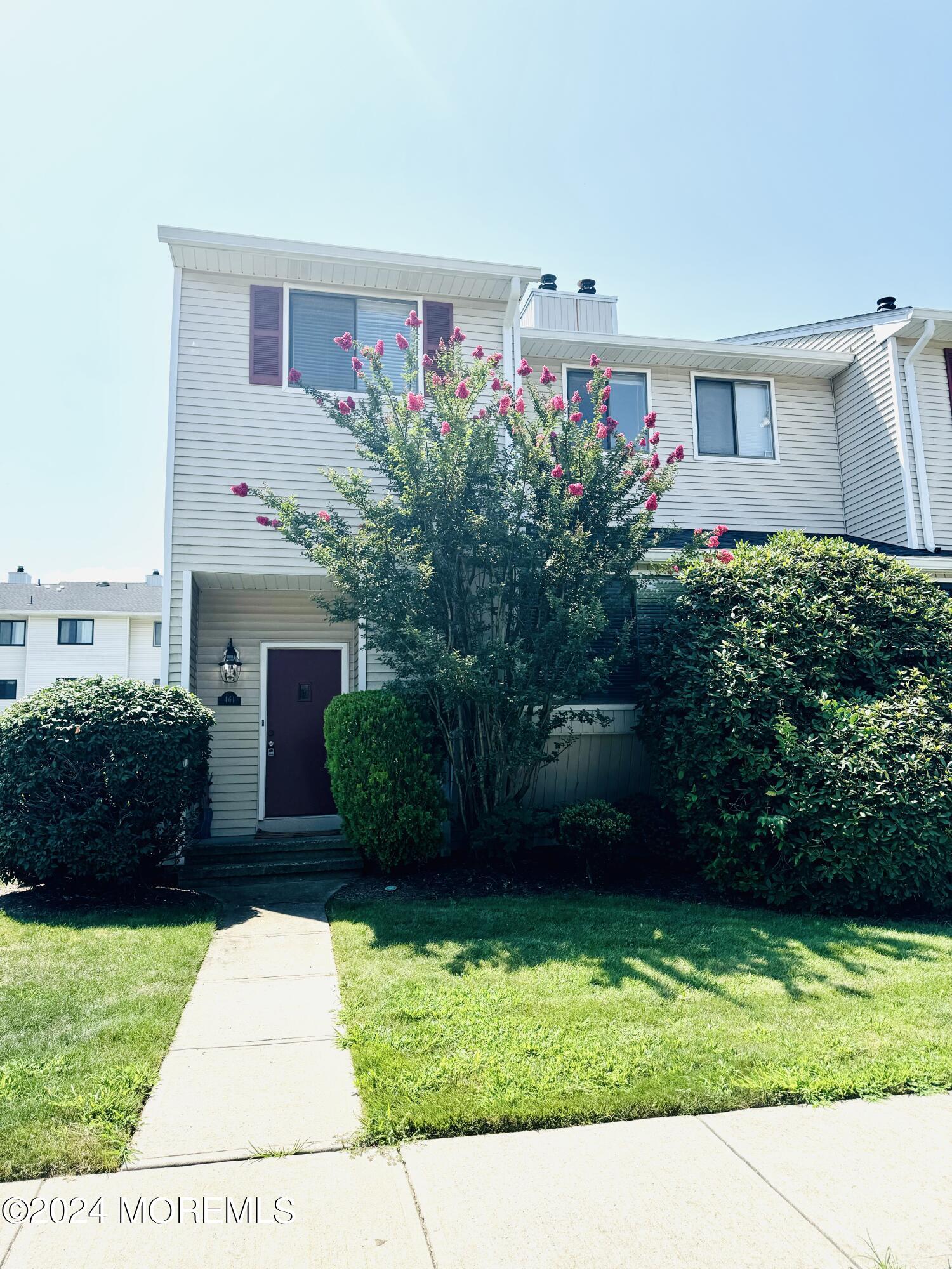 a view front of house with a garden