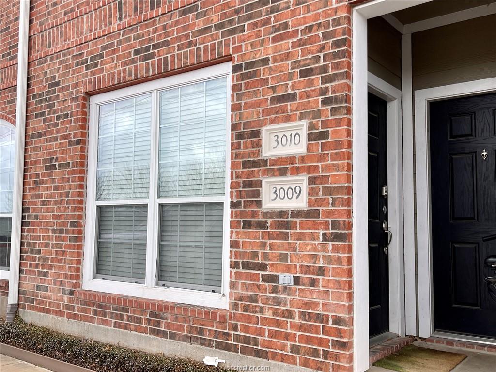 a view of a brick building with a window