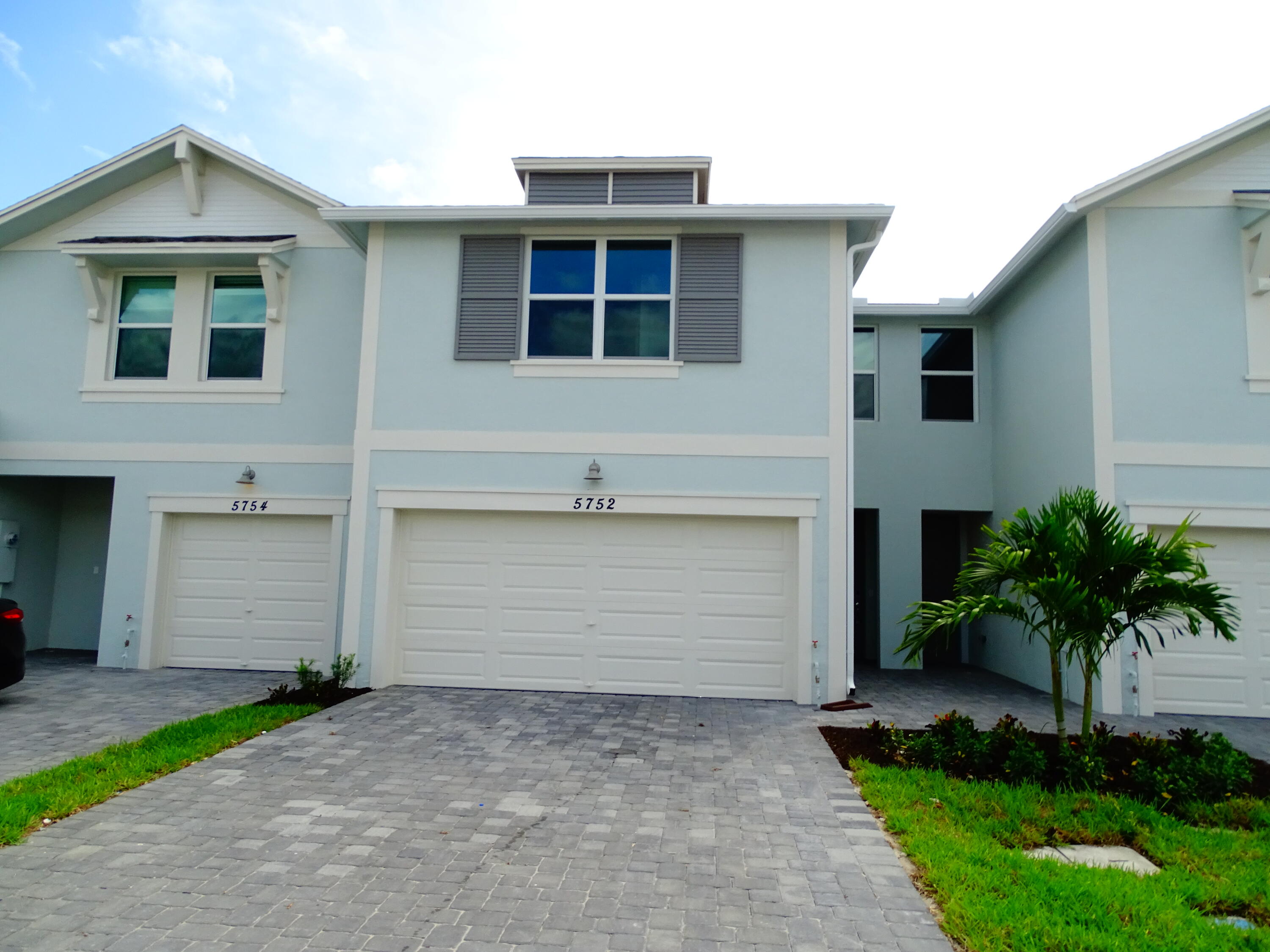 a front view of a house with a garage