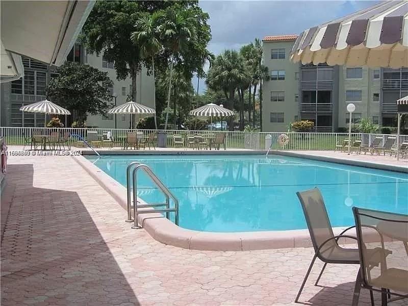 a view of a swimming pool with a patio