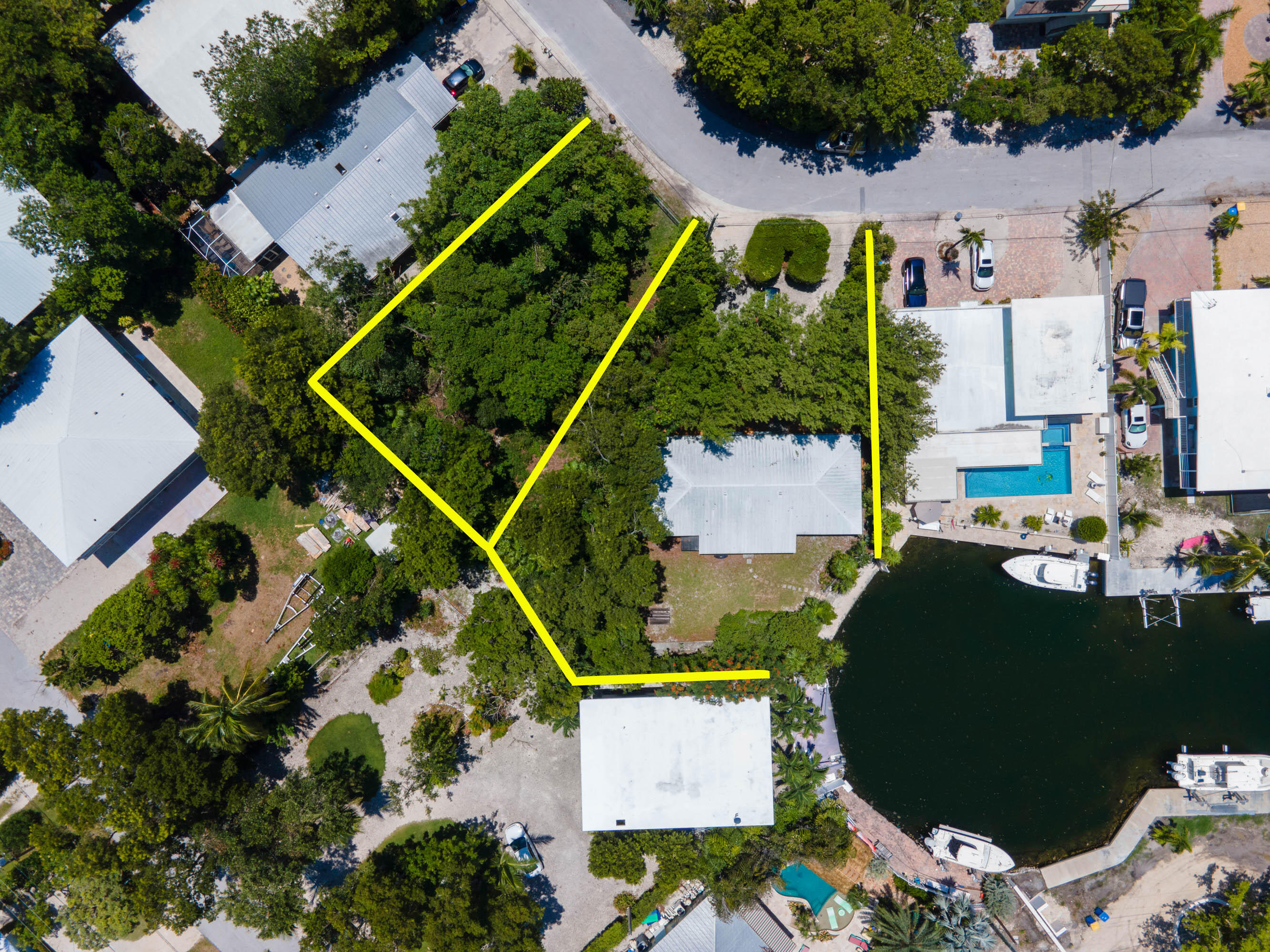 an aerial view of houses with outdoor space