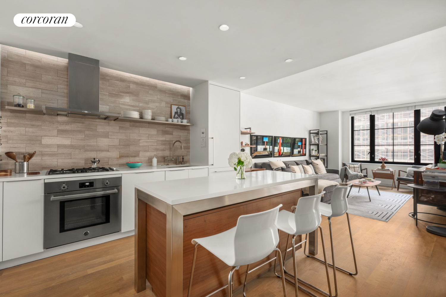 a kitchen with a stove a table and chairs in it