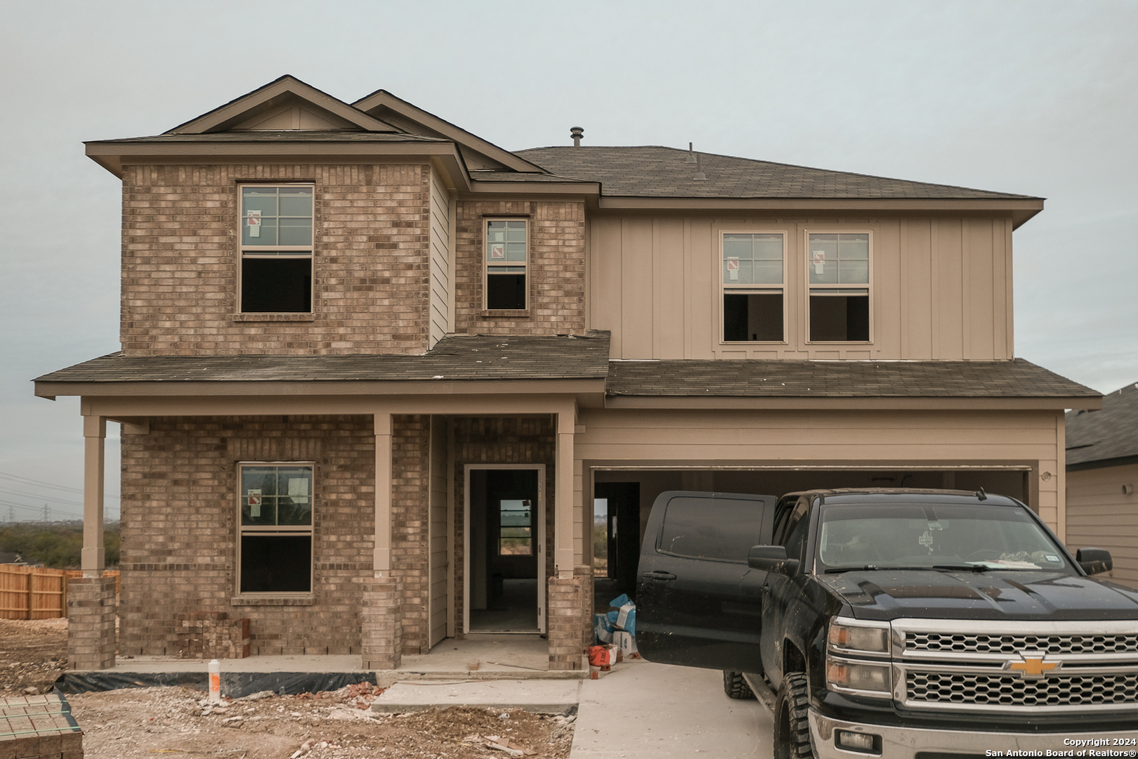 a front view of a house with parking space