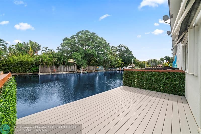 a view of swimming pool with a lake view