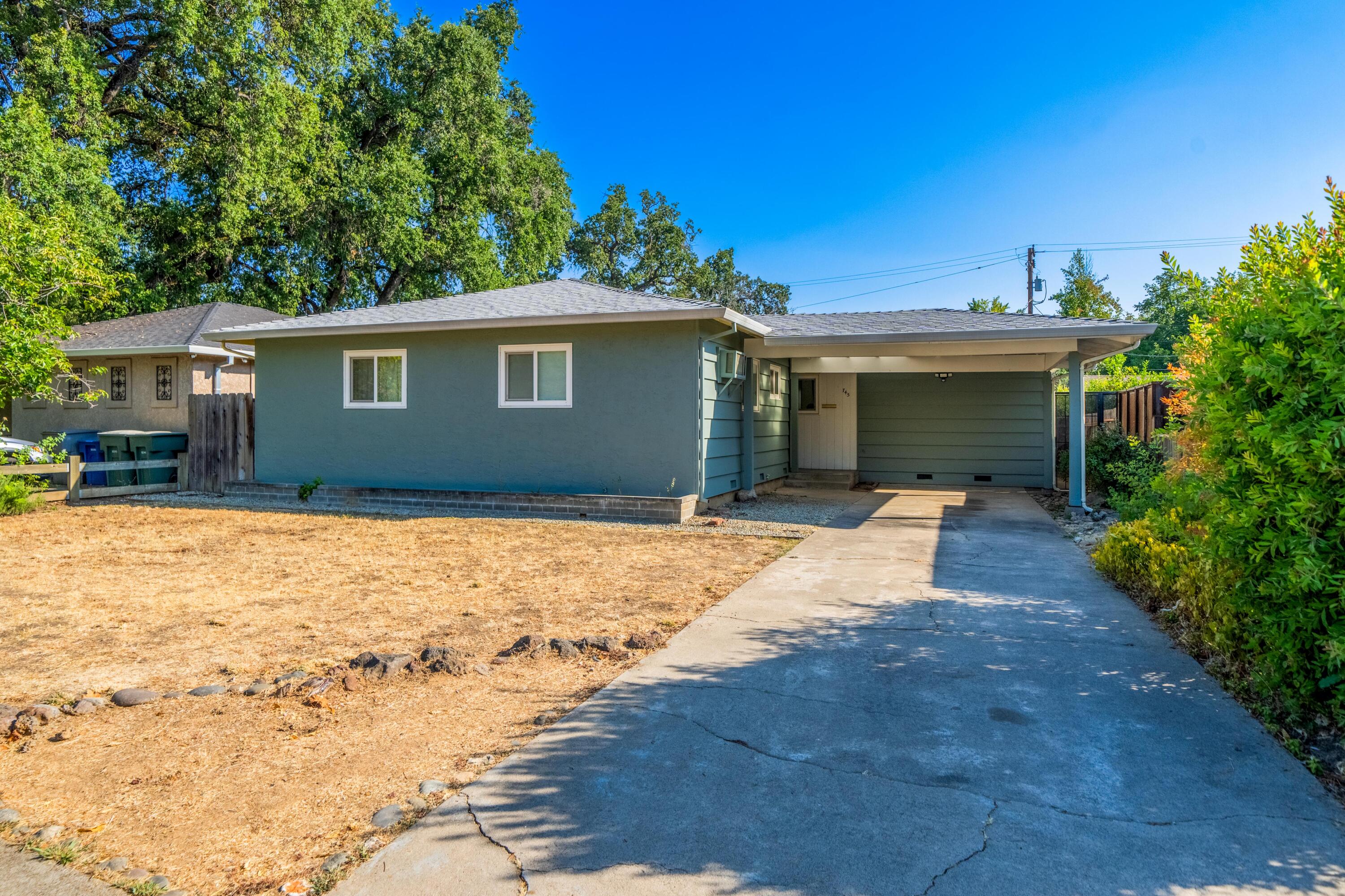 a view of a house with a yard