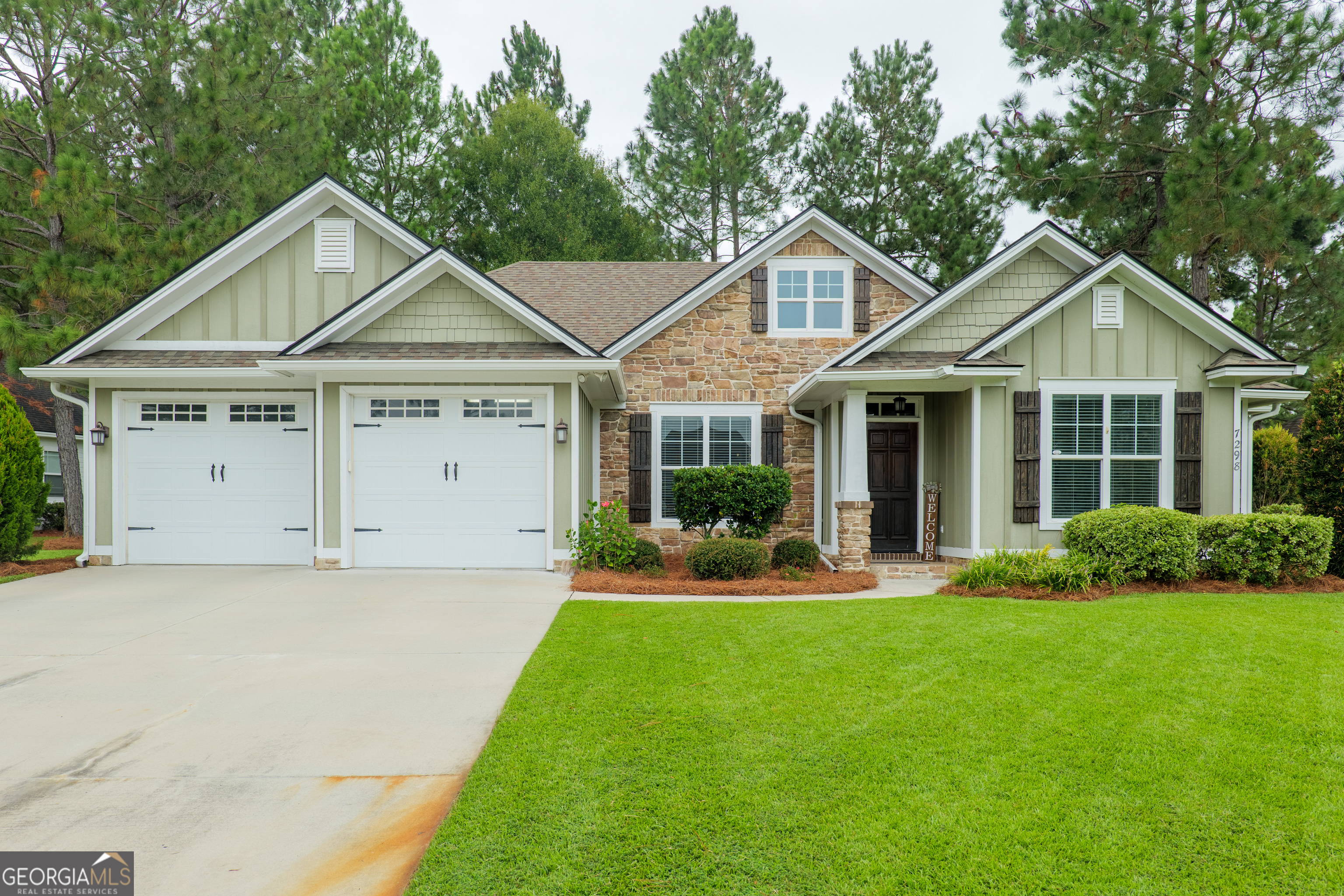 a front view of a house with a yard and porch